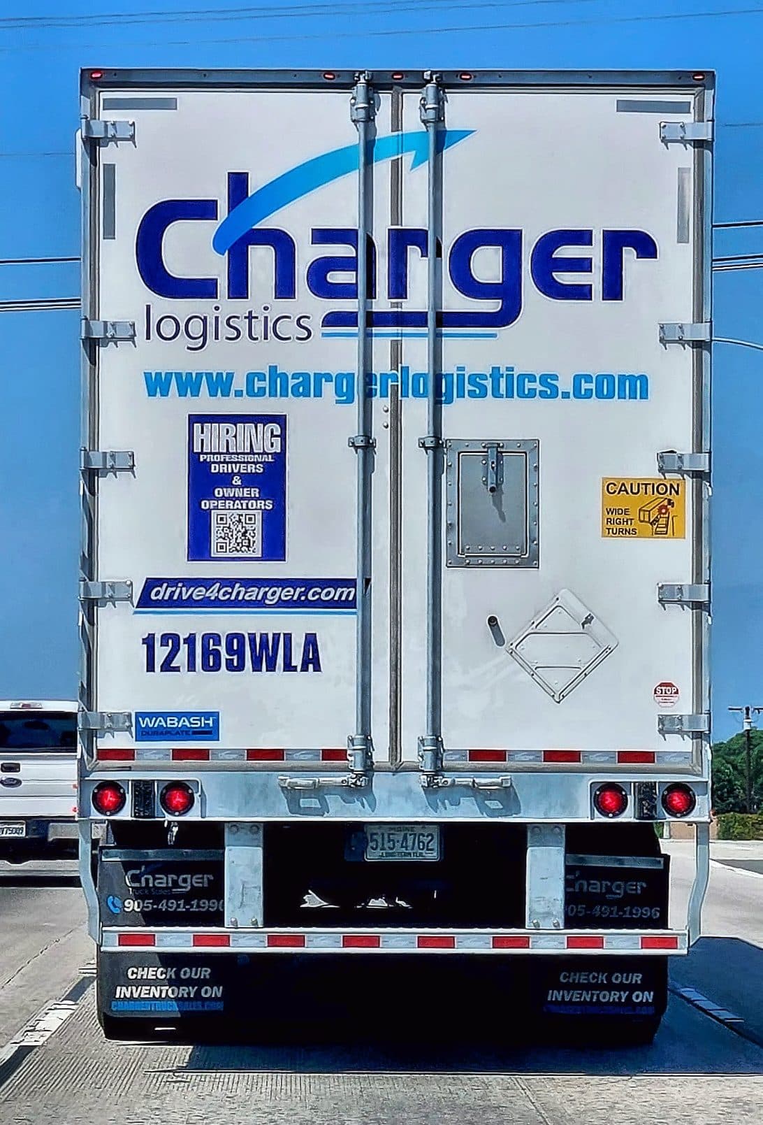 Rear doors and placards of a white 53-foot dry van trailer